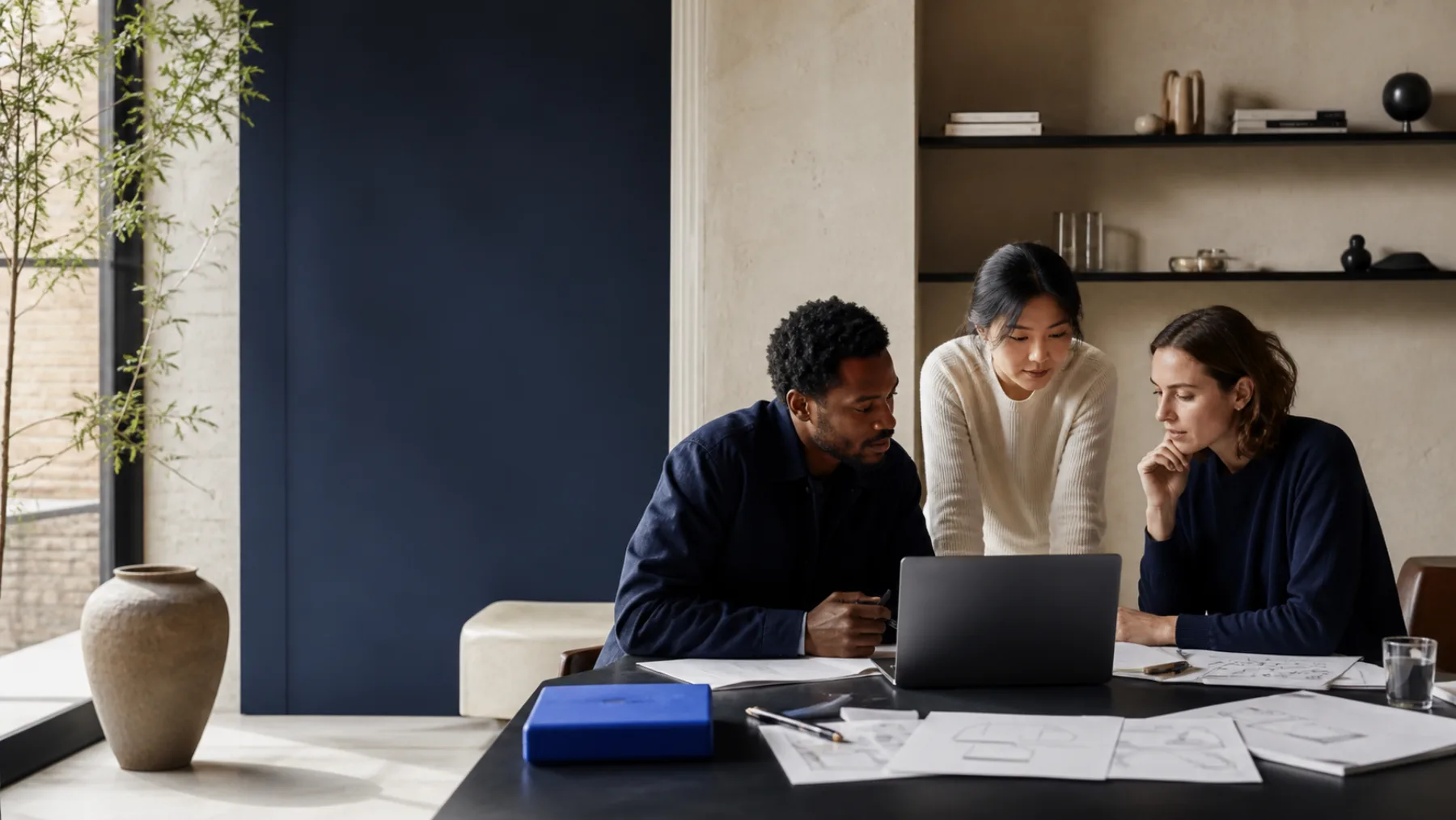 Independent digital professionals collaborating around a table